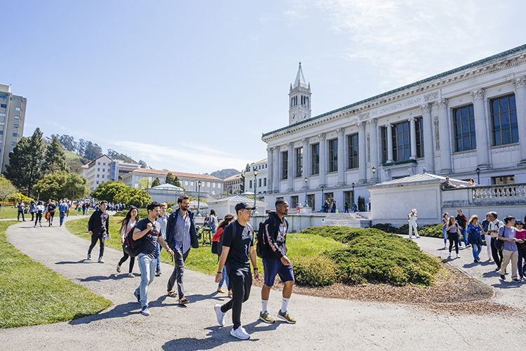 Berkeley students walking through campus, smiling